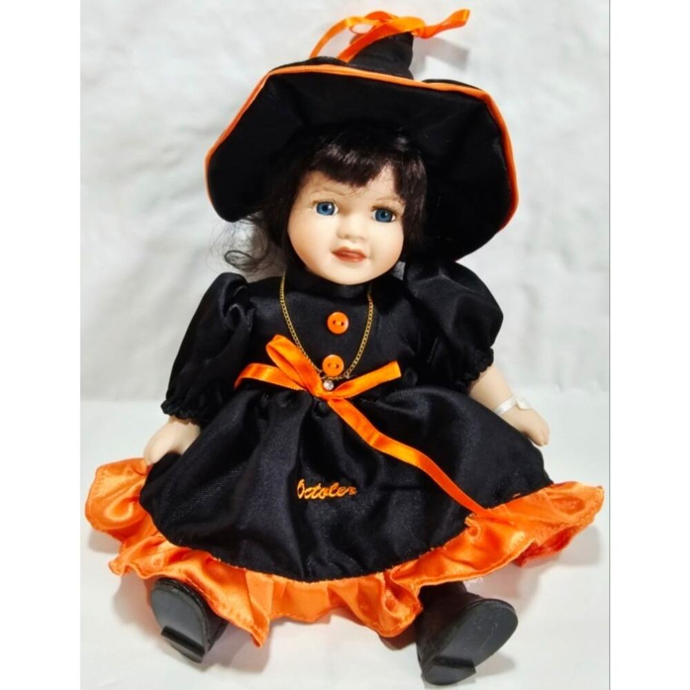 Halloween October Witch Porcelain Doll Seated Black and Orange Dress w/ Hat